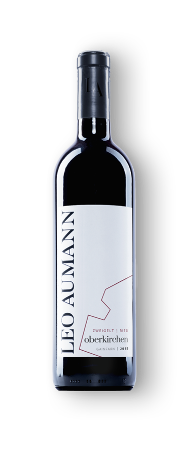 A bottle of red wine from Leo Aumann with a white label and minimalist black and red text design.